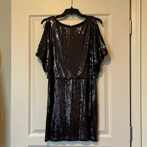 The Perfect LBD! Just enough shine for any holiday occasion. An Xscape design!